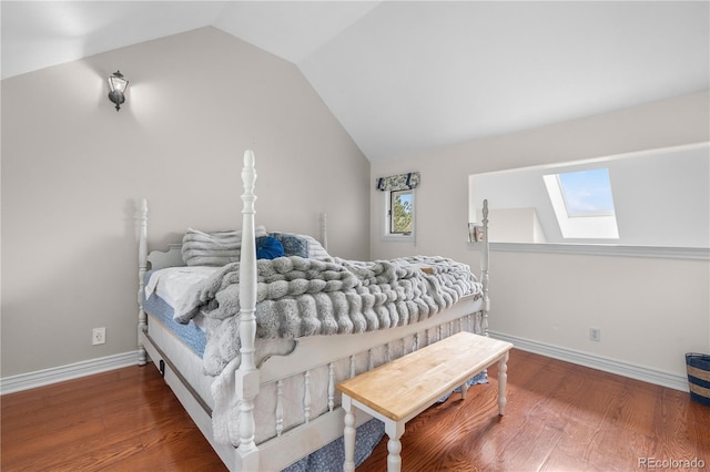 137 Bob Cat Trl, Bailey, CO 80421 - bedroom with a skylight, vaulted ceiling, wood finished floors, and baseboards
