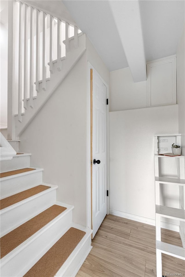 137 Bob Cat Trl, Bailey, CO 80421 - staircase featuring wood finished floors and baseboards