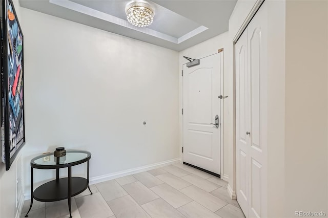 300 W 11th Ave Unit 4F, Denver, CO 80204 - foyer entrance featuring a raised ceiling and baseboards