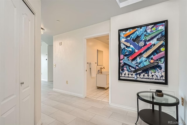 300 W 11th Ave Unit 4F, Denver, CO 80204 - hall with light tile patterned flooring and baseboards