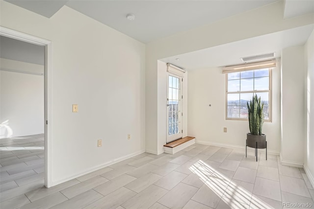 300 W 11th Ave Unit 4F, Denver, CO 80204 - spare room featuring baseboards and a smoke detector