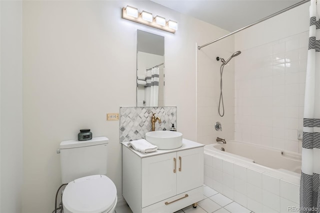 300 W 11th Ave Unit 4F, Denver, CO 80204 - bathroom with tiled shower / bath combo, vanity, toilet, decorative backsplash, and tile patterned floors