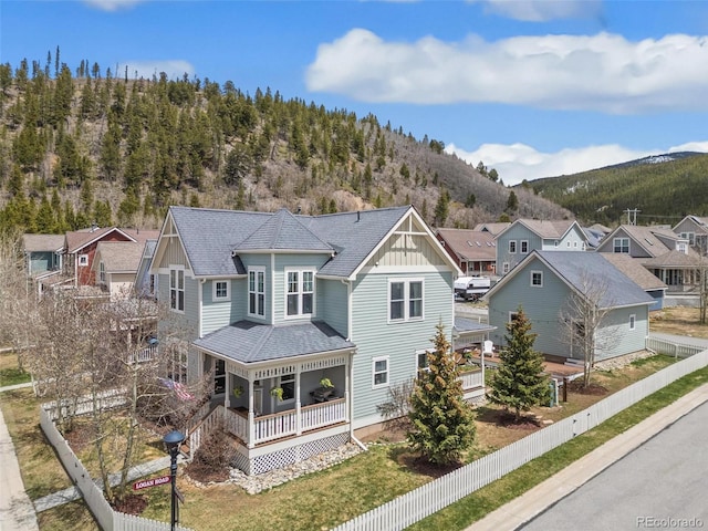 45 Bridge St, Breckenridge, CO 80424 - back of property featuring a porch, a mountain view, board and batten siding, and a residential view