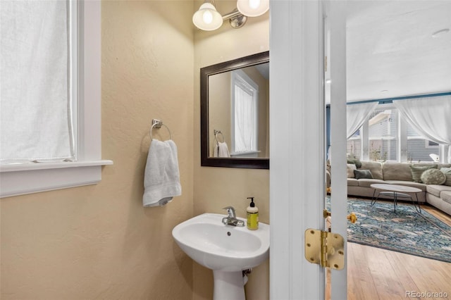 45 Bridge St, Breckenridge, CO 80424 - bathroom featuring wood finished floors, a textured wall, and a sink