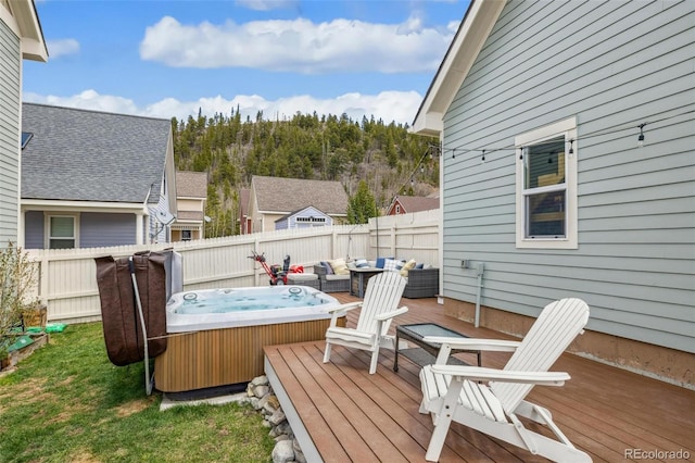 45 Bridge St, Breckenridge, CO 80424 - wooden terrace featuring a hot tub, a fenced backyard, and an outdoor hangout area