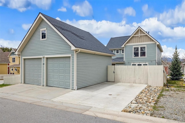45 Bridge St, Breckenridge, CO 80424 - view of front of property featuring a shingled roof, an outdoor structure, a garage, and board and batten siding