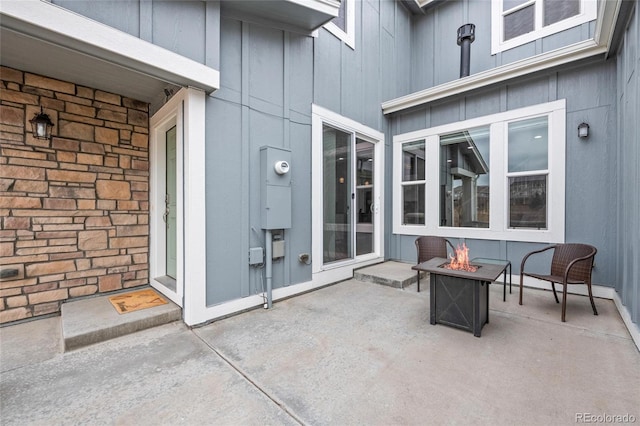 view of patio / terrace with a fire pit
