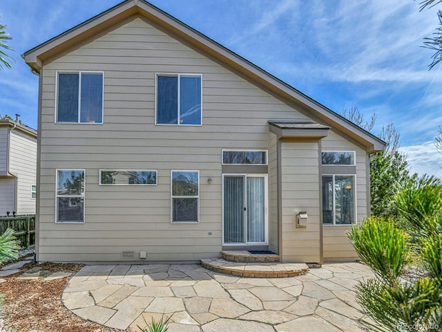 back of house featuring a patio area and fence