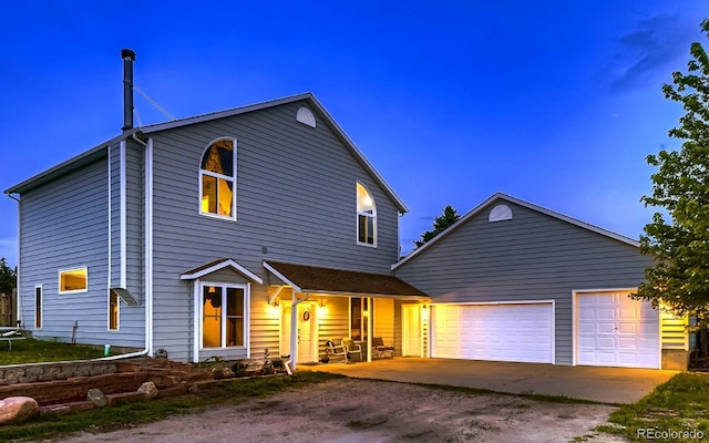 8370 Midsummer Ln, Elizabeth, CO 80107 - view of front facade featuring covered porch, driveway, and a garage