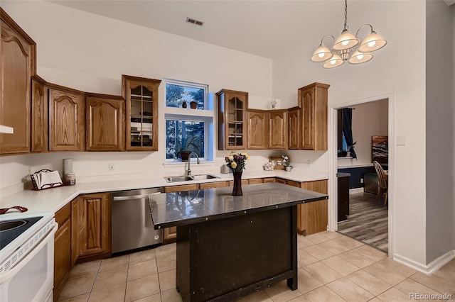 8370 Midsummer Ln, Elizabeth, CO 80107 - kitchen with dishwasher, electric stove, light tile patterned flooring, a chandelier, and a high ceiling