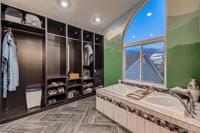 8370 Midsummer Ln, Elizabeth, CO 80107 - mudroom featuring a textured wall