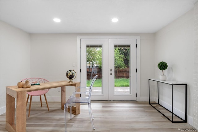 doorway to outside featuring french doors, light wood-style flooring, recessed lighting, and baseboards