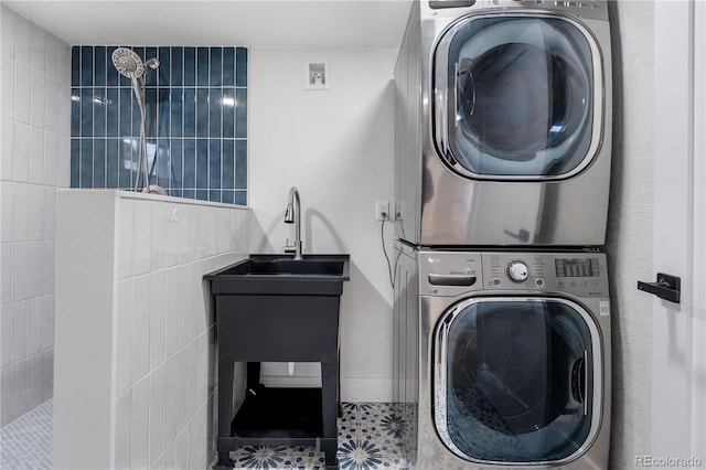 laundry room with stacked washer / drying machine
