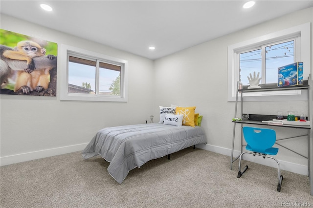 carpeted bedroom with multiple windows, baseboards, and recessed lighting