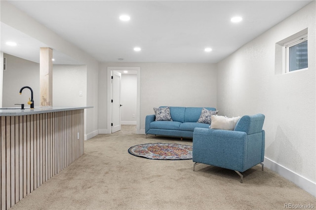 living area with carpet floors, recessed lighting, wet bar, and baseboards