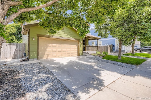 676 Hedgerow Way, Brighton, CO 80601 - view of property hidden behind natural elements featuring driveway and an attached garage