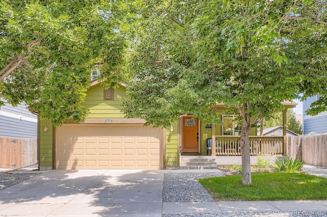 676 Hedgerow Way, Brighton, CO 80601 - obstructed view of property featuring driveway, a garage, and covered porch
