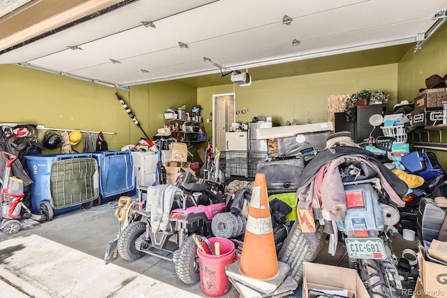 676 Hedgerow Way, Brighton, CO 80601 - garage featuring a garage door opener