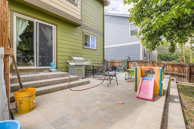 676 Hedgerow Way, Brighton, CO 80601 - fenced backyard with a patio, outdoor dining space, and area for grilling