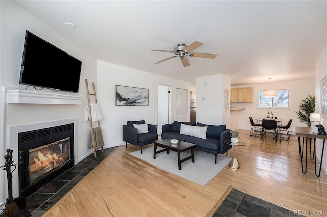 1830 22nd St Unit 16, Boulder, CO 80302 - living area with wood finished floors, ceiling fan, and a glass covered fireplace