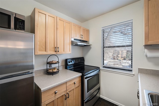 1830 22nd St Unit 16, Boulder, CO 80302 - kitchen with appliances with stainless steel finishes, under cabinet range hood, light brown cabinets, light countertops, and dark tile patterned flooring