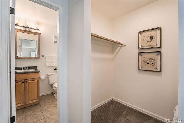 1830 22nd St Unit 16, Boulder, CO 80302 - walk in closet with a sink and light tile patterned floors