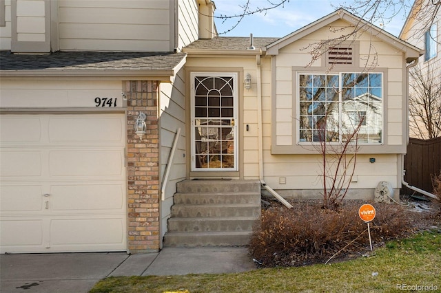 doorway to property with a shingled roof, crawl space, and fence