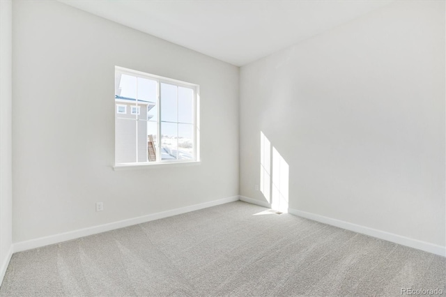 empty room featuring light carpet