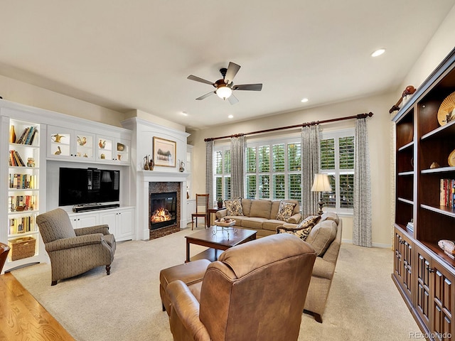 2571 Hunters Pl, Highlands Ranch, CO 80129 - living area with a fireplace, light carpet, a ceiling fan, and recessed lighting