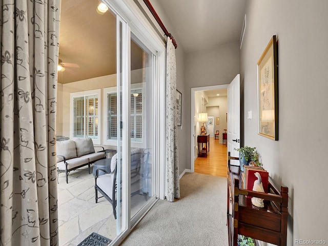 2571 Hunters Pl, Highlands Ranch, CO 80129 - hallway featuring baseboards and carpet