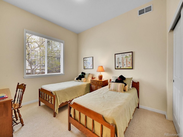 2571 Hunters Pl, Highlands Ranch, CO 80129 - bedroom featuring light carpet, baseboards, and visible vents
