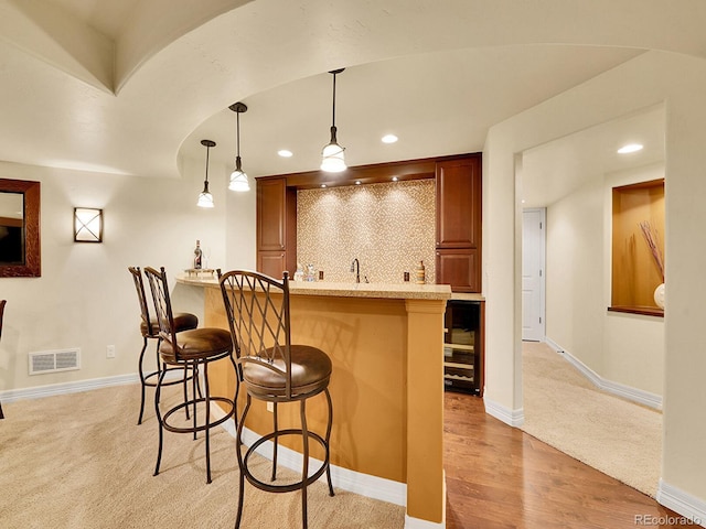 2571 Hunters Pl, Highlands Ranch, CO 80129 - bar featuring visible vents, recessed lighting, beverage cooler, and indoor wet bar