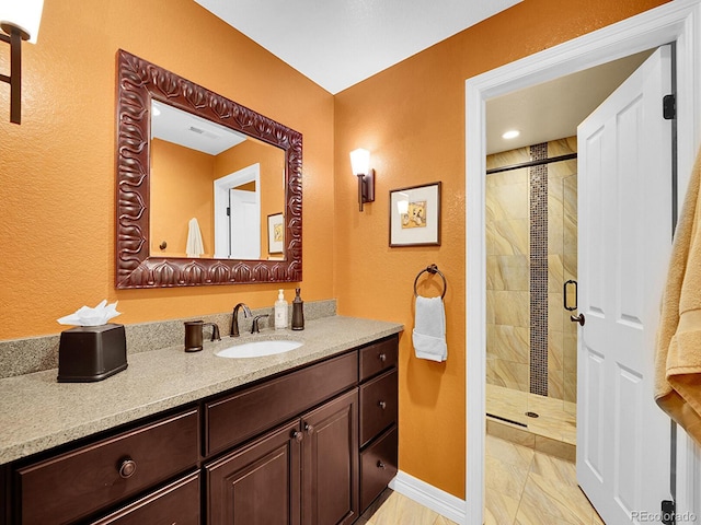 2571 Hunters Pl, Highlands Ranch, CO 80129 - full bath with vanity, visible vents, baseboards, and a shower stall