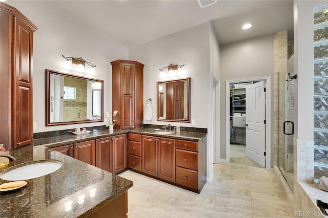 2571 Hunters Pl, Highlands Ranch, CO 80129 - full bath with a shower stall, double vanity, and a spacious closet