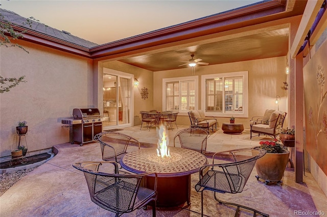 2571 Hunters Pl, Highlands Ranch, CO 80129 - patio terrace at dusk with ceiling fan, grilling area, and a fire pit