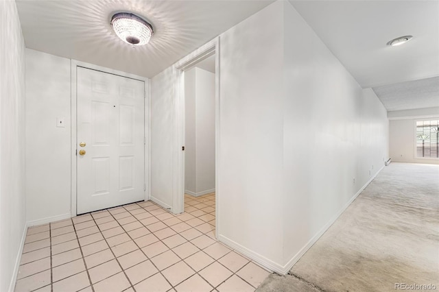 view of carpeted foyer