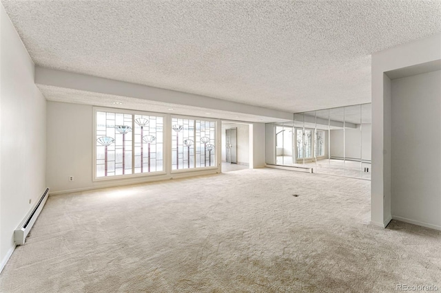 unfurnished living room featuring light colored carpet, a wealth of natural light, and a baseboard radiator