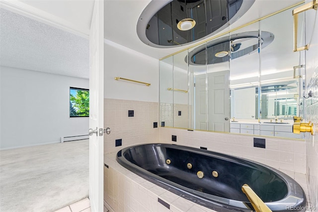 bathroom with tile patterned floors, a relaxing tiled tub, a textured ceiling, and a baseboard heating unit