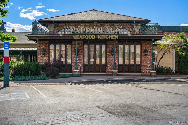 7000 E Quincy Ave Unit 204, Denver, CO 80237 - view of building exterior with uncovered parking