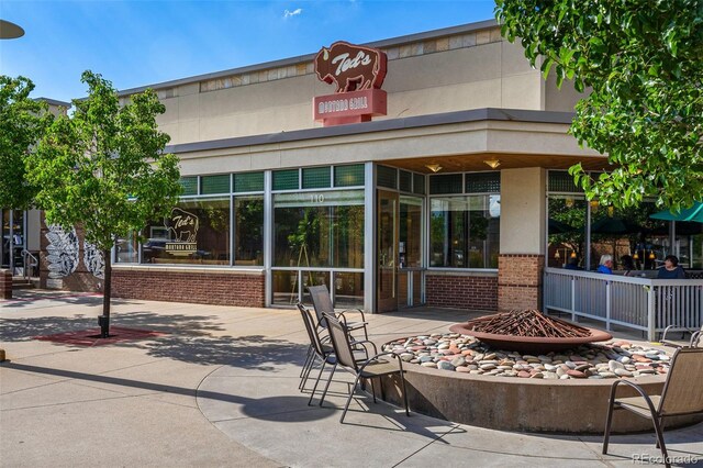 7000 E Quincy Ave Unit 204, Denver, CO 80237 - view of property featuring an outdoor fire pit