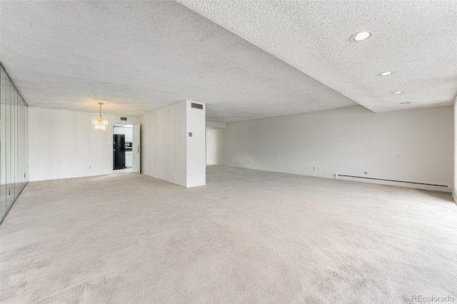 7000 E Quincy Ave Unit 204, Denver, CO 80237 - unfurnished living room with light colored carpet, a chandelier, a baseboard heating unit, recessed lighting, and a textured ceiling