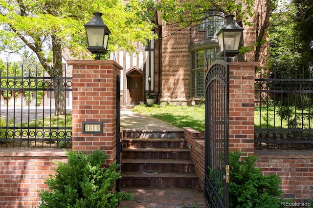 view of gate featuring fence