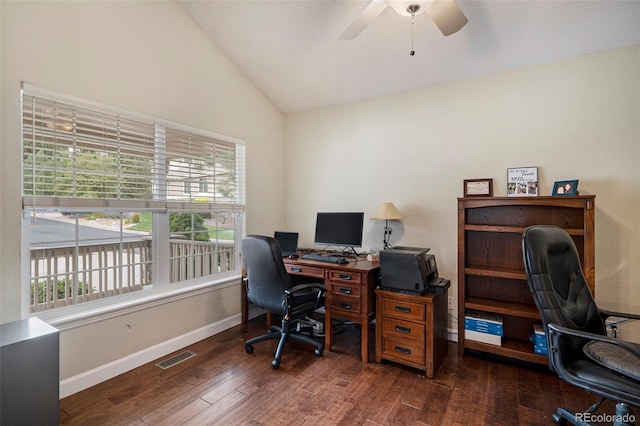 home office with vaulted ceiling, wood finished floors, ceiling fan, plenty of natural light, and baseboards