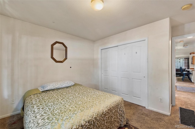 carpeted bedroom with a closet