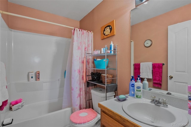 full bathroom featuring toilet, shower / bath combo with shower curtain, and vanity