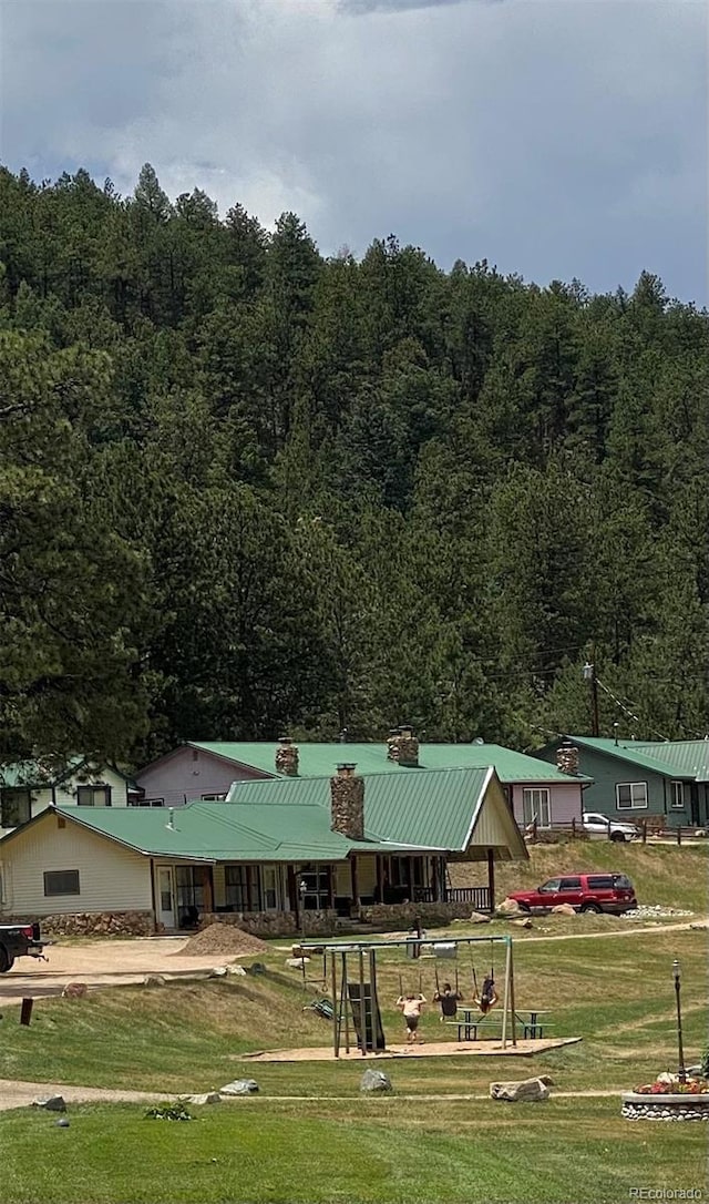 57920 US Highway 285 Unit 23/24, Bailey, CO 80421 - view of property's community featuring a wooded view and a lawn