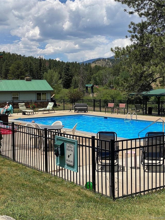 57920 US Highway 285 Unit 23/24, Bailey, CO 80421 - community pool with a patio area and a view of trees