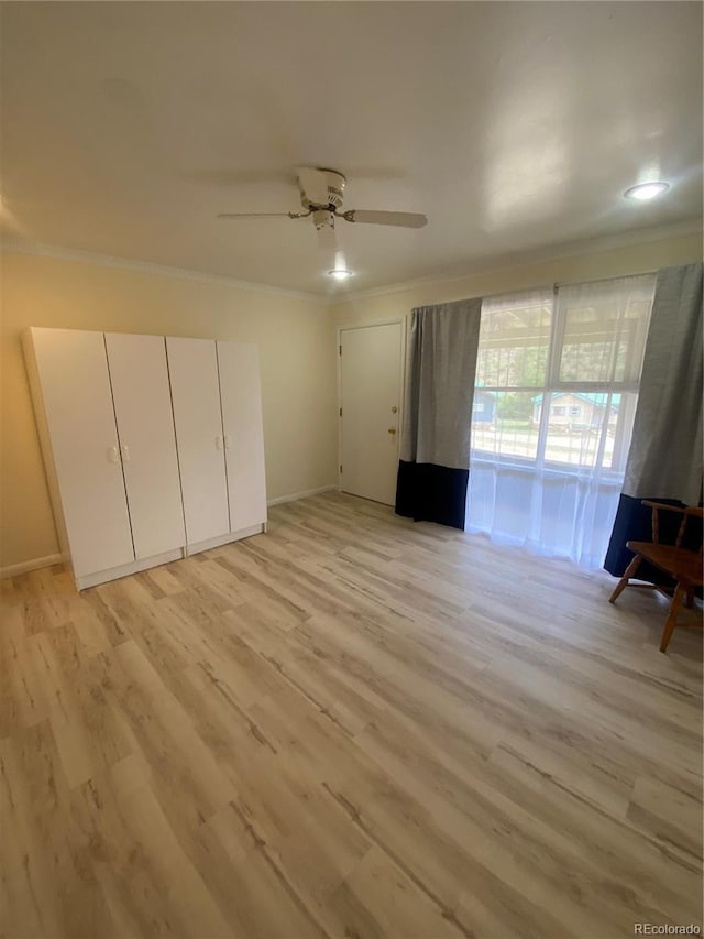 57920 US Highway 285 Unit 23/24, Bailey, CO 80421 - unfurnished bedroom featuring ornamental molding, light wood-type flooring, and a ceiling fan