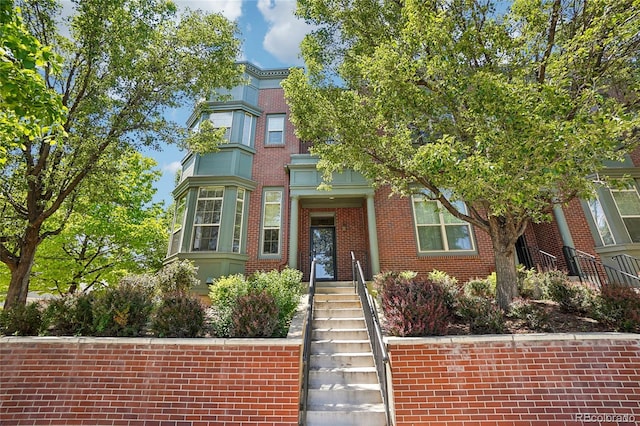 2933 Central Park Blvd, Denver, CO 80238 - view of front facade featuring brick siding