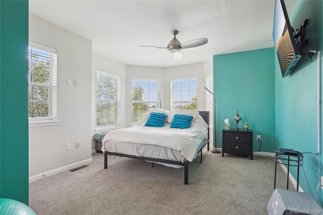 2933 Central Park Blvd, Denver, CO 80238 - bedroom with carpet, baseboards, and ceiling fan